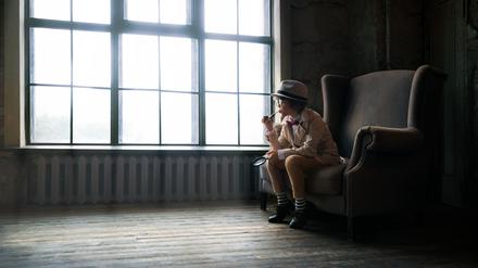 Boy in a chair in studio