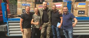 Adrian Rauko (links) mit seinen Mitarbeitern und Kiews Bürgermeister Vitali Klitschko.