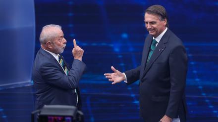 Luiz Inacio Lula da Silva (l) und Jair Bolsonaro konkurrieren um das Präsidentenamt. 
