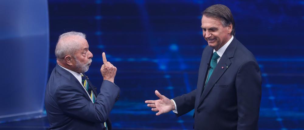 Luiz Inacio Lula da Silva (l) und Jair Bolsonaro konkurrieren um das Präsidentenamt. 