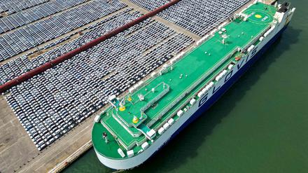 (FILES) This aerial photo taken on June 1, 2023 shows rows of cars that will be exported at Yantai port, in China's eastern Shandong province. China saw its biggest drop in exports last month since July 2020, according to official figures released on August 8, 2023, as the world's second-largest economy faces sluggish global demand and a domestic slowdown. (Photo by AFP) / China OUT