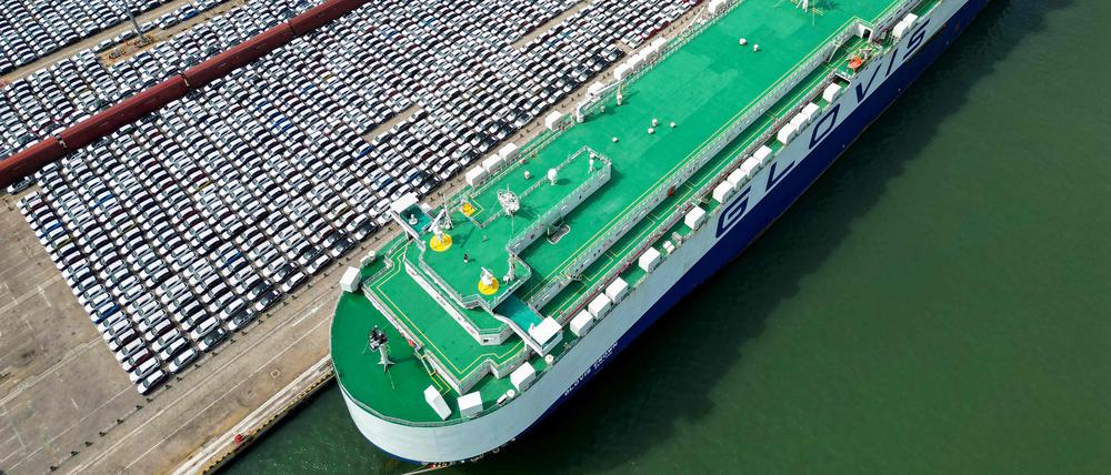 (FILES) This aerial photo taken on June 1, 2023 shows rows of cars that will be exported at Yantai port, in China's eastern Shandong province. China saw its biggest drop in exports last month since July 2020, according to official figures released on August 8, 2023, as the world's second-largest economy faces sluggish global demand and a domestic slowdown. (Photo by AFP) / China OUT