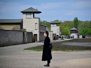 Visitors are seen at the former Sachsen-hausen Nazi concentration camp on April 23, 2024 in Oranienburg near Berlin, northeastern Germany. The site of what is now the Sachsenhausen memorial centre was one of the biggest concentration camps on German territory from 1936 to 1945. (Photo by Tobias SCHWARZ / AFP)