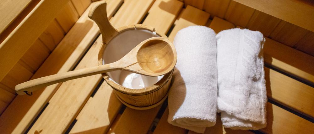 Indoor of a Finnish sauna, with a water bucket , Spa and Wellness concept in a hotel