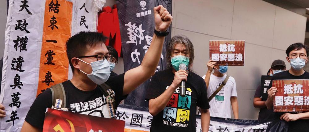 Soziale Demokraten gegen den Kommunismus. Eine in Richtung Peking adressierte Demonstration Hongkonger Aktivisten nach der Verabschiedung des neuen chinesischen Sicherheitsgesetzes (1.7.2020). 