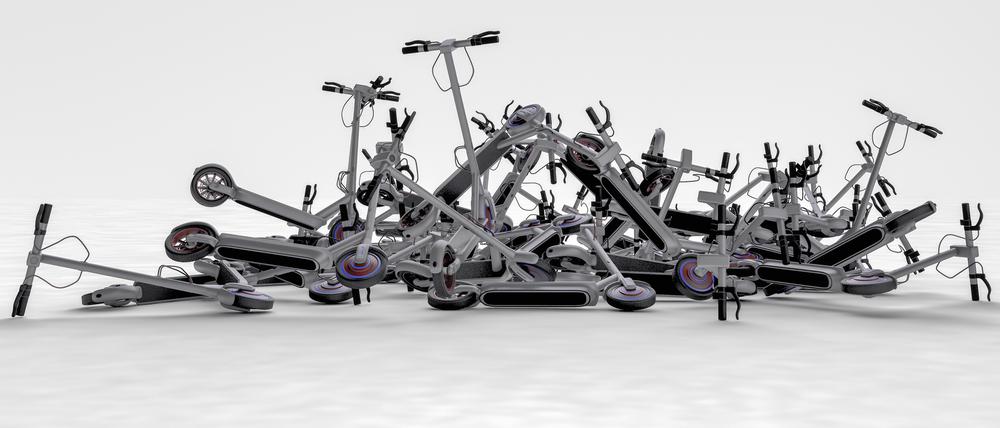 Electric scooter scrap on a pile (3d rendering)
