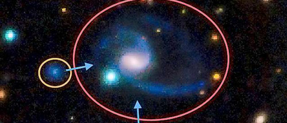 Diese Aufnahme zeigt einen der beiden "Zwillinge" des Milchstraßen-Systems. Die zentrale Galaxie (GAMA202627) ist ähnlich der Milchstraße und hat zwei größere Begleiter, ähnlich den Magellanschen Wolken in unserer kosmischen Nachbarschaft.